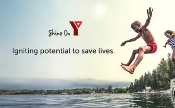children jumping into lake from dock in summer YMCA Shine On Logo, slogan 'Igniting Potential to Save Lives'