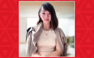 Young women with slight smile in office chair