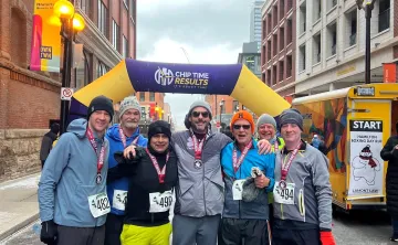 Runners standing at finish line of running race