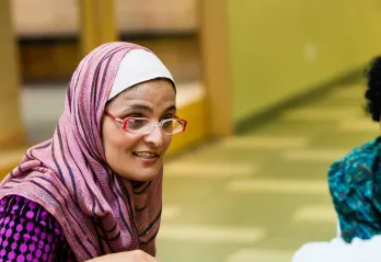 Immigrant woman in group conversation
