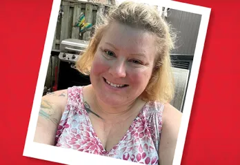 A photo of Angela in her backyard wearing a floral shirt