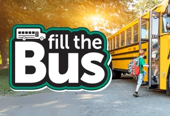 Fill The Bus logo with child getting on bus 