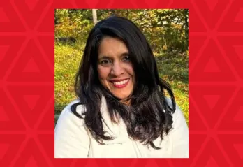 woman in white sweater smiling