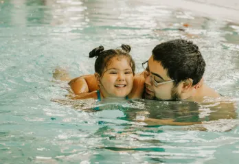 father daughter swimming pool