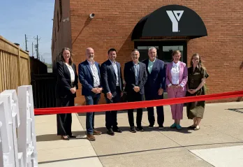 Individuals at ribbon cutting event