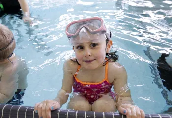 Female child participating in swim lessons