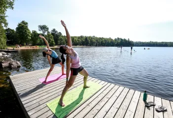 People Stretching on Dock at YMCA Wanakita
