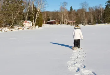 Woman walking through snow