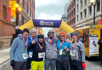 Runners standing at finish line of running race