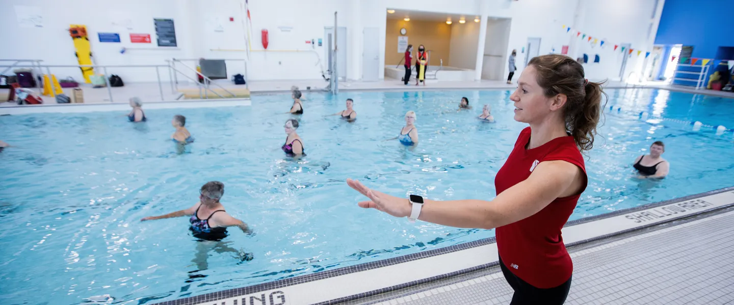Female Instructor leading an Aquafit class in pool