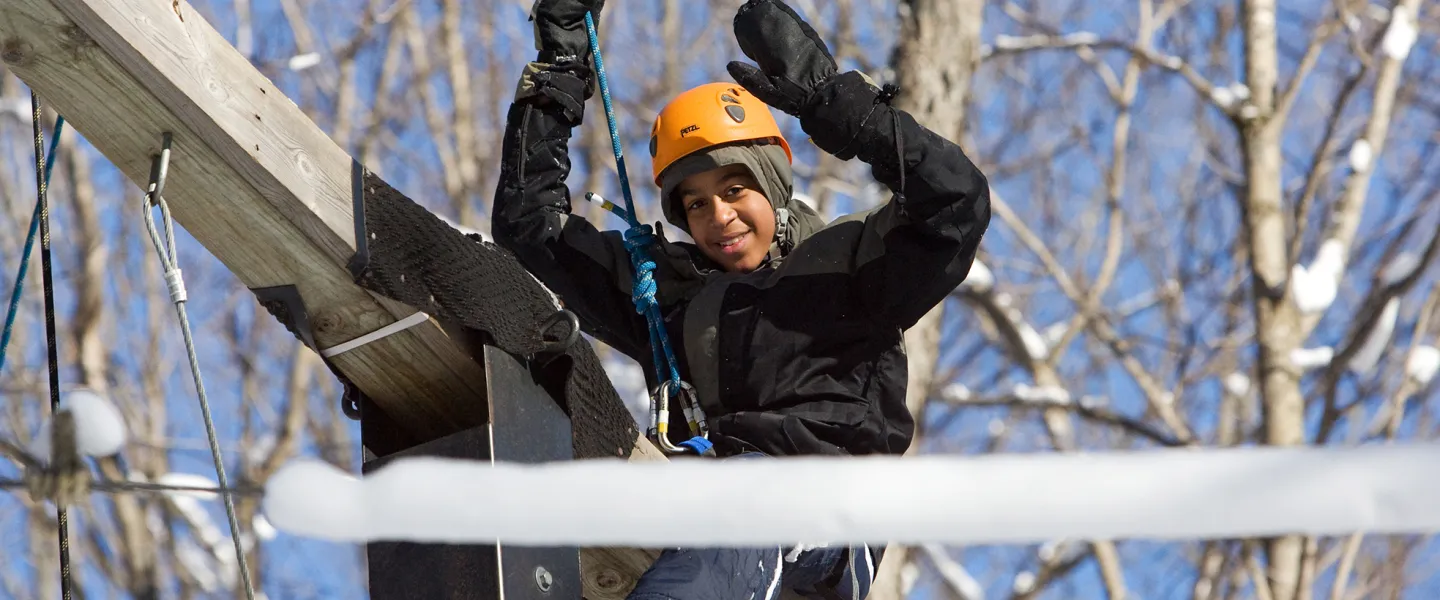 Youth boy on high ropes