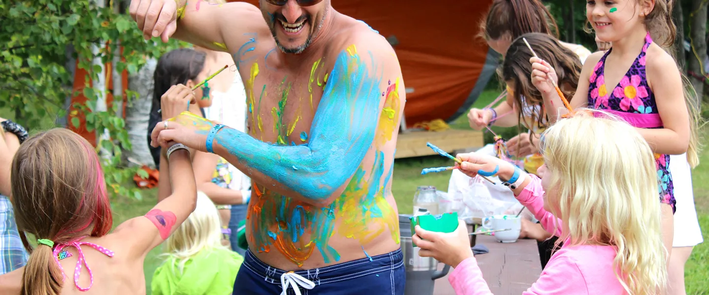 Family engaging in a playful paint fight