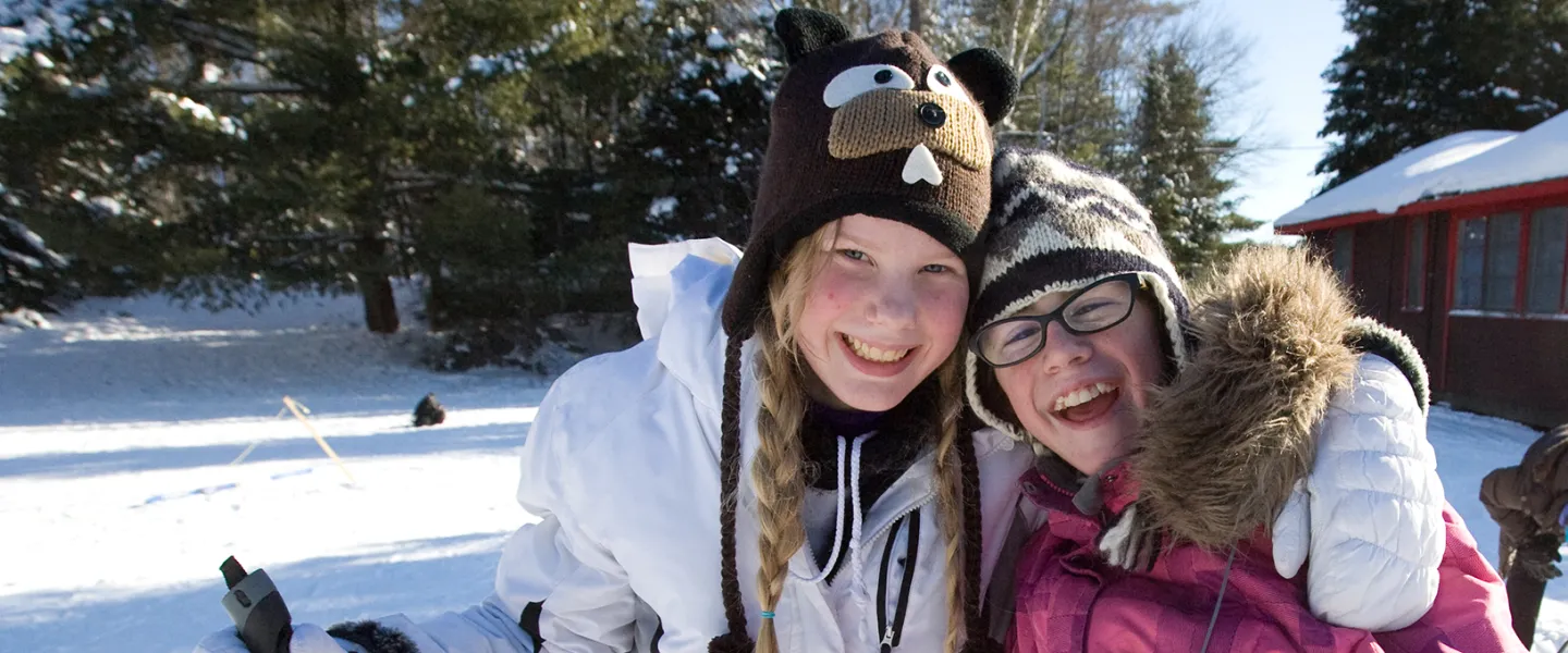 Two youth girls hugging