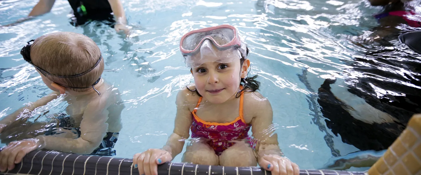 Female child participating in swim lessons