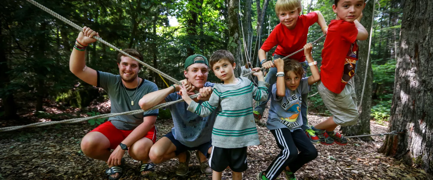 Wanakita male campers participating in low ropes