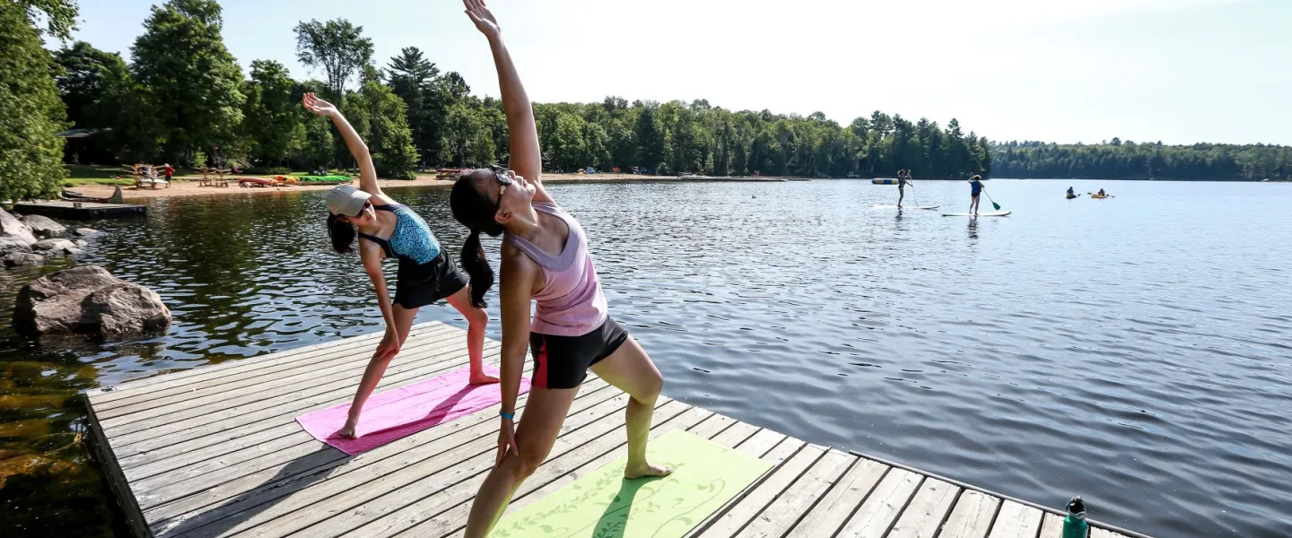 People Stretching on Dock at YMCA Wanakita