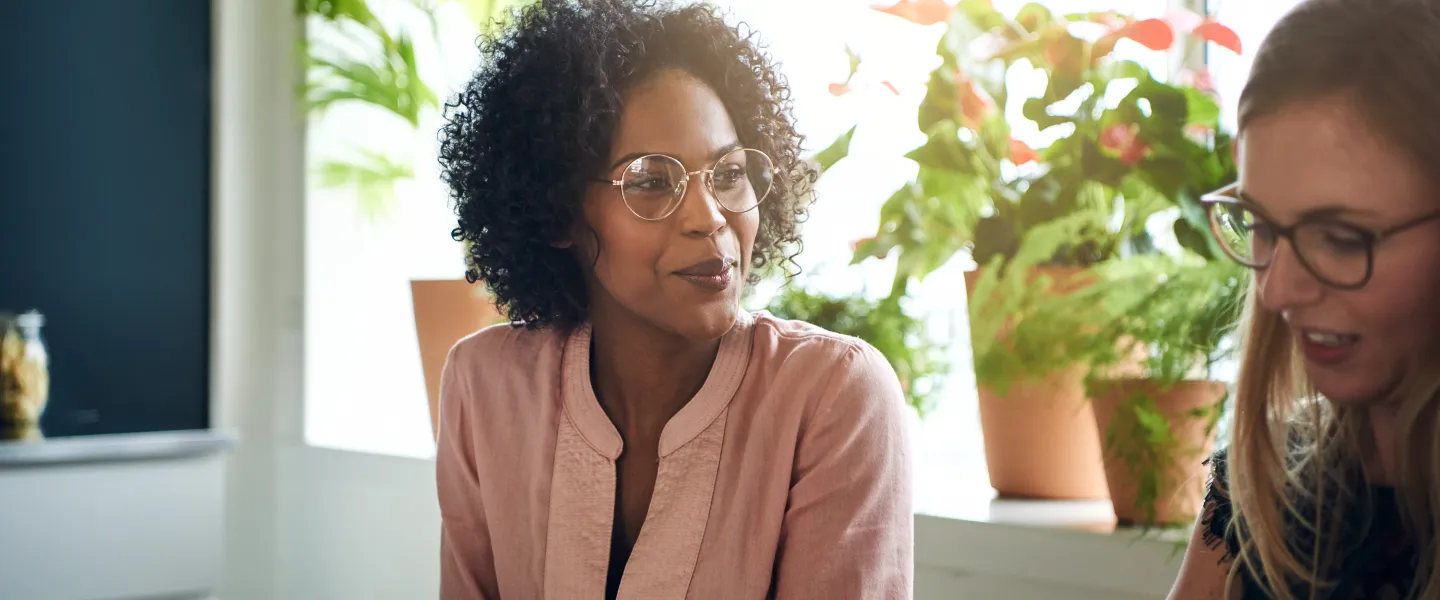 Two women looking at laptop