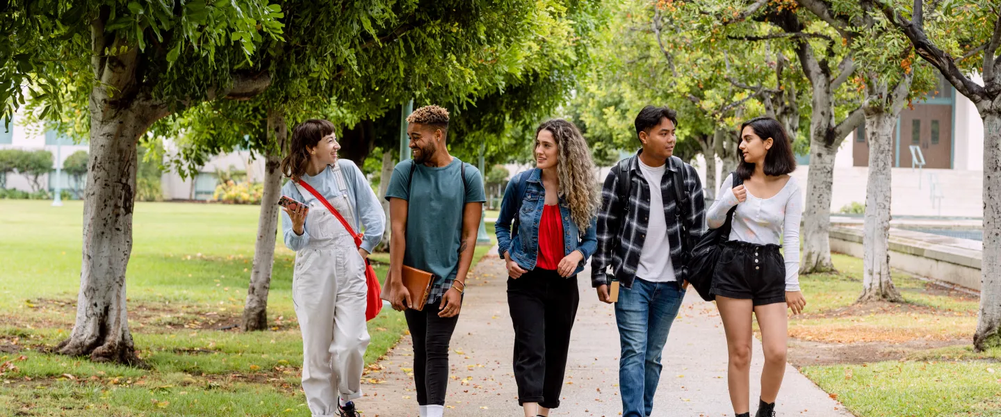 five young people walking together