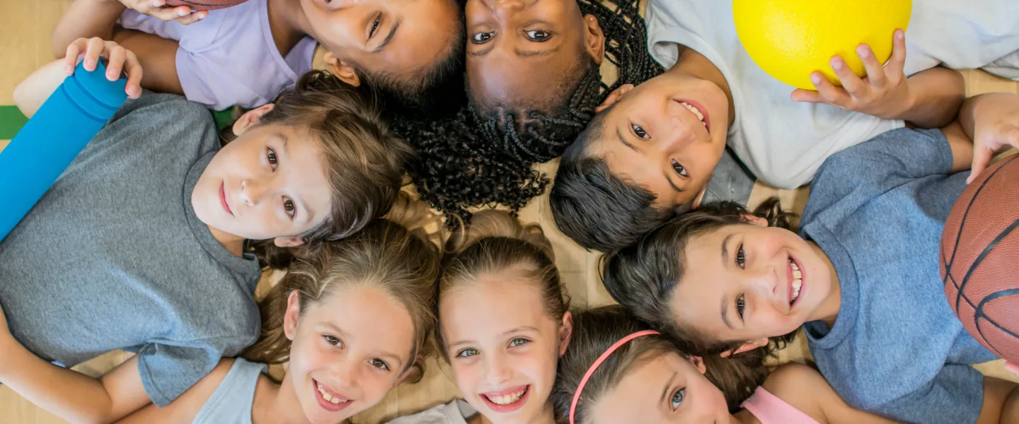 Group of kids laying on floor