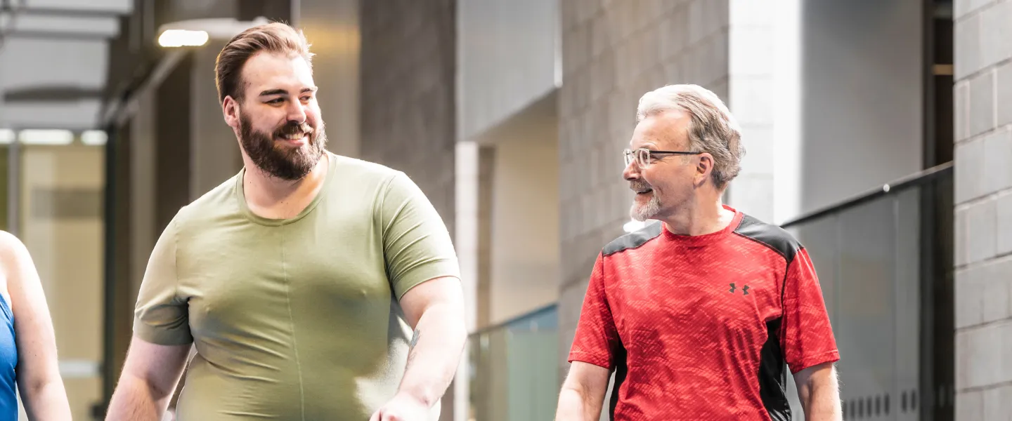 Group of three walking around smiling