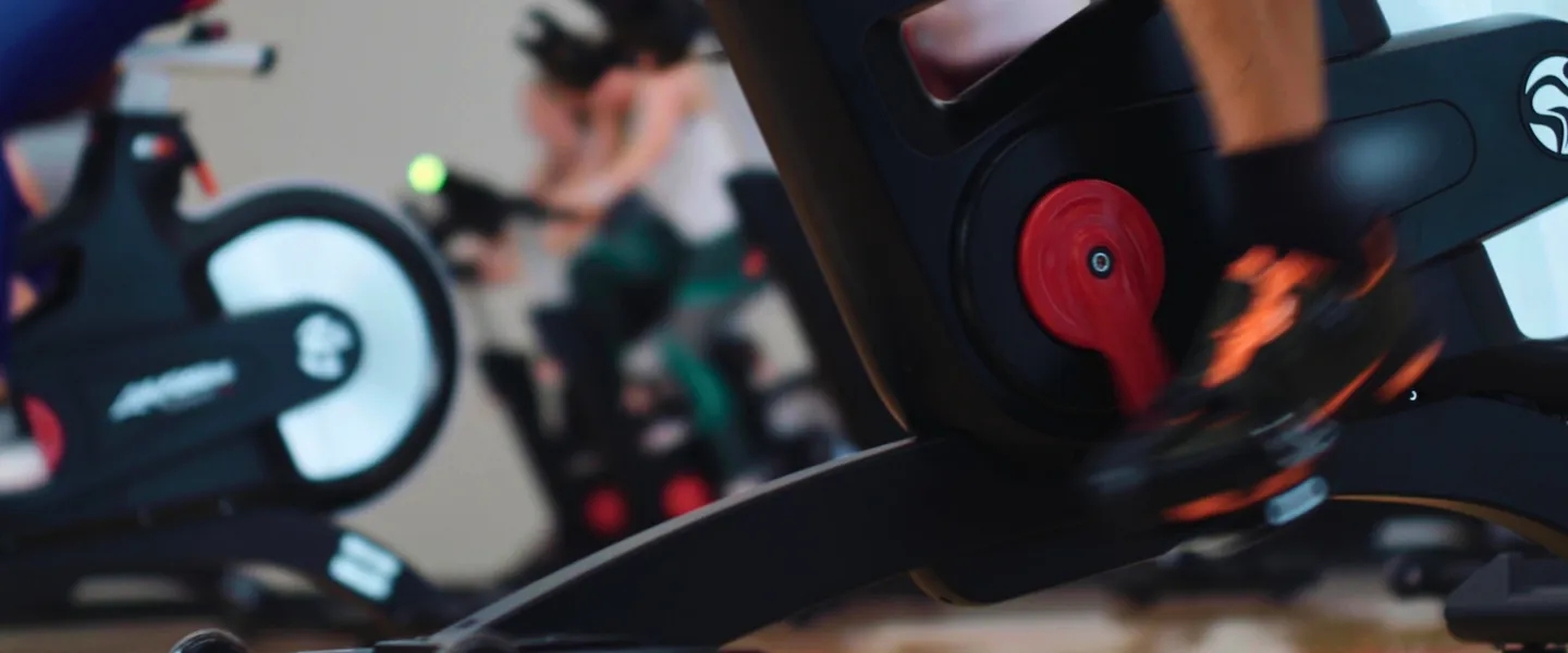 Group ridng on bikes at gym