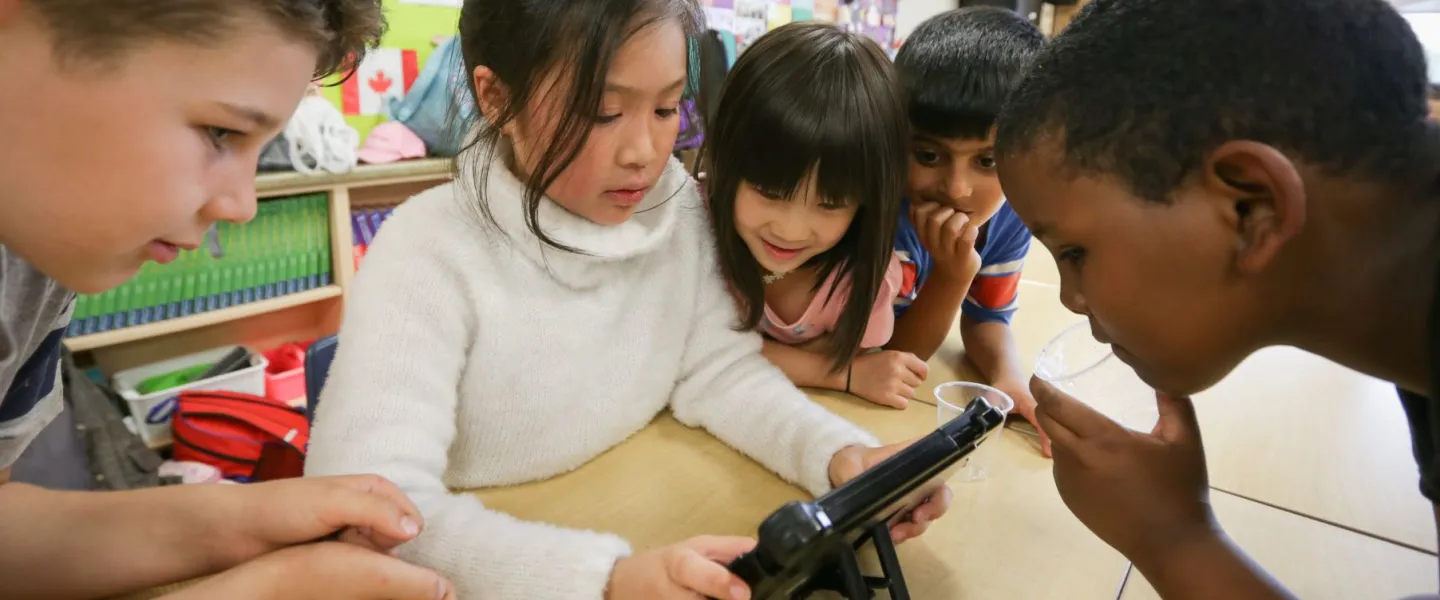 Children working on iPad at YMCA Beyond the Bell