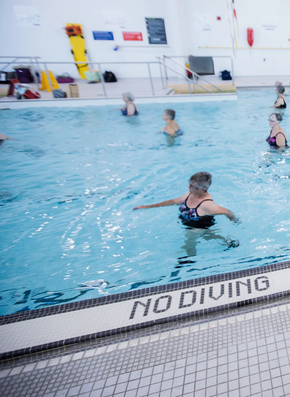 Female Instructor leading an Aquafit class in pool