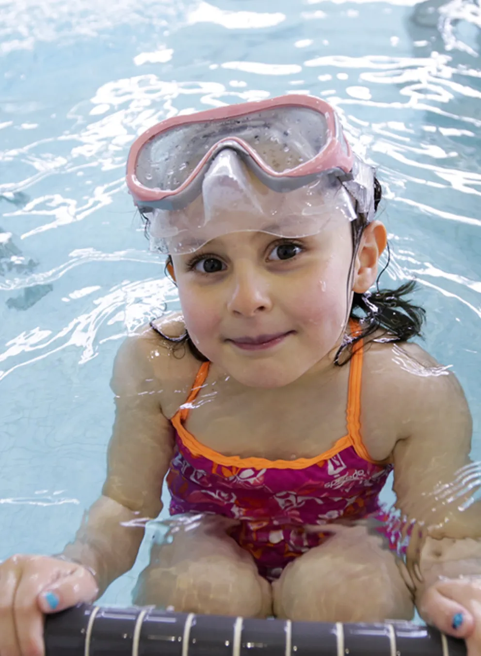 Female child participating in swim lessons