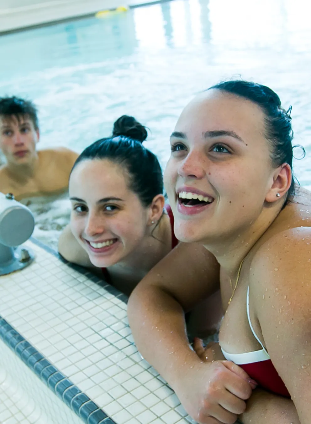 Group of lifeguards smiling in pool