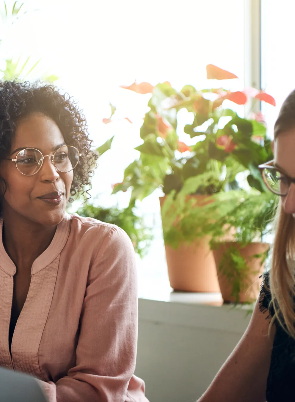 Two women looking at laptop