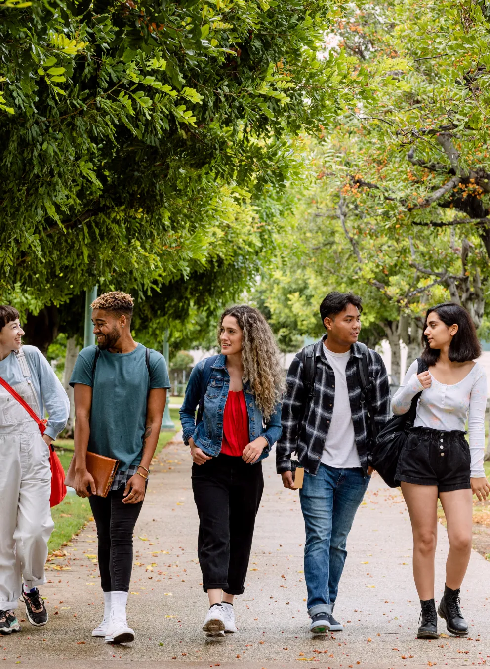 five young people walking together