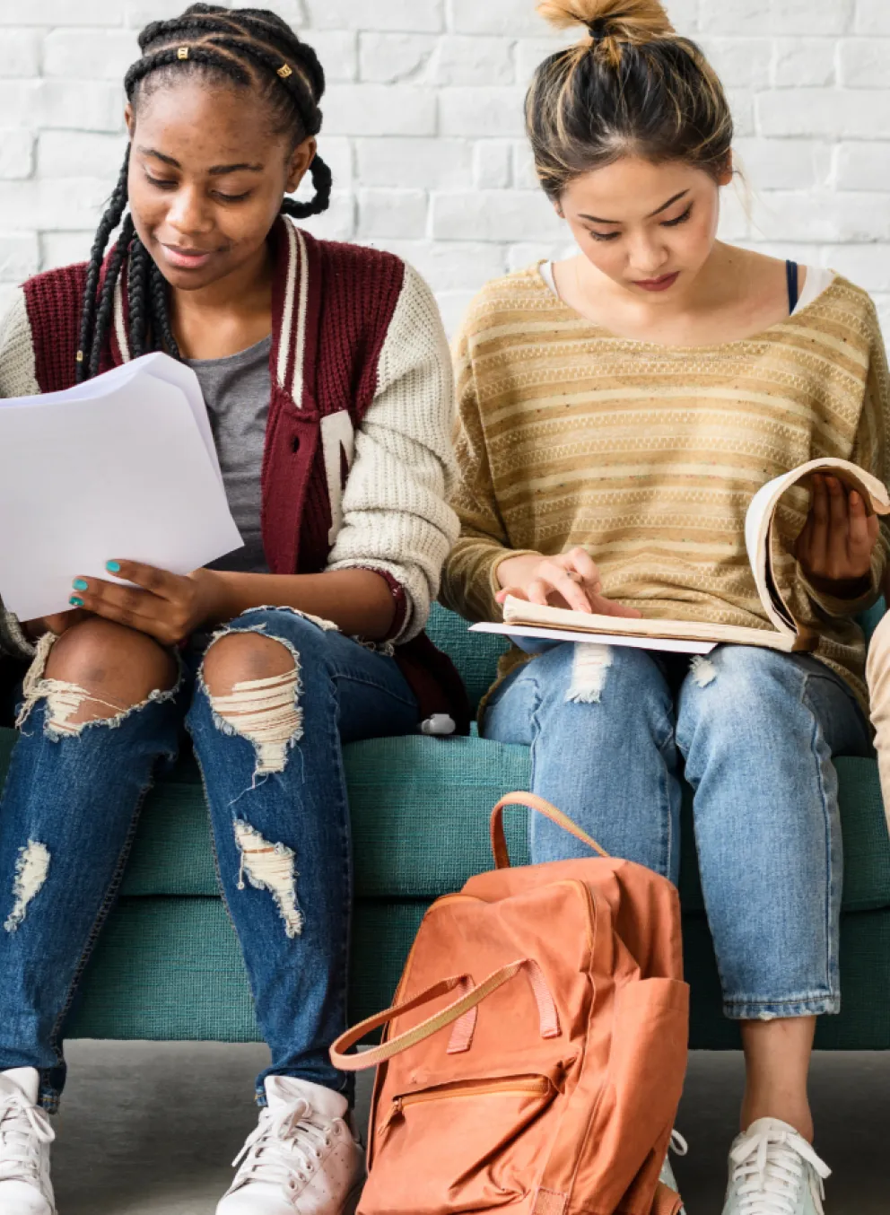 Youth looking at books studying
