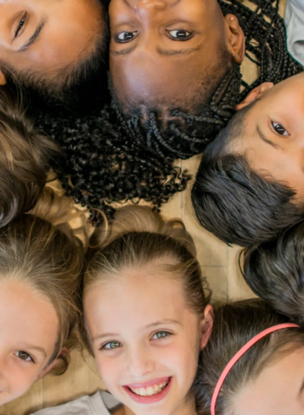 Group of kids laying on floor