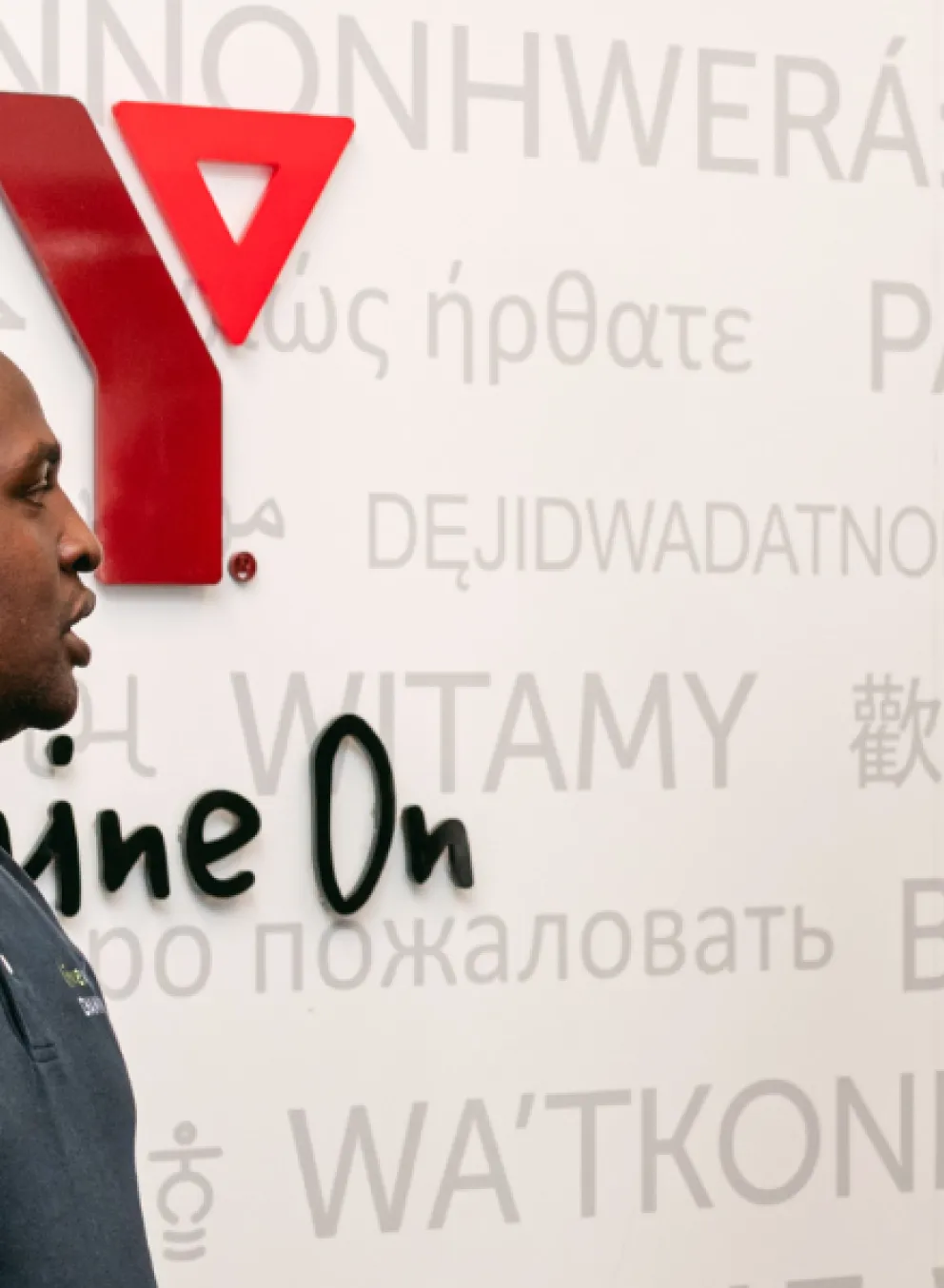 Two people standing in front of a wall