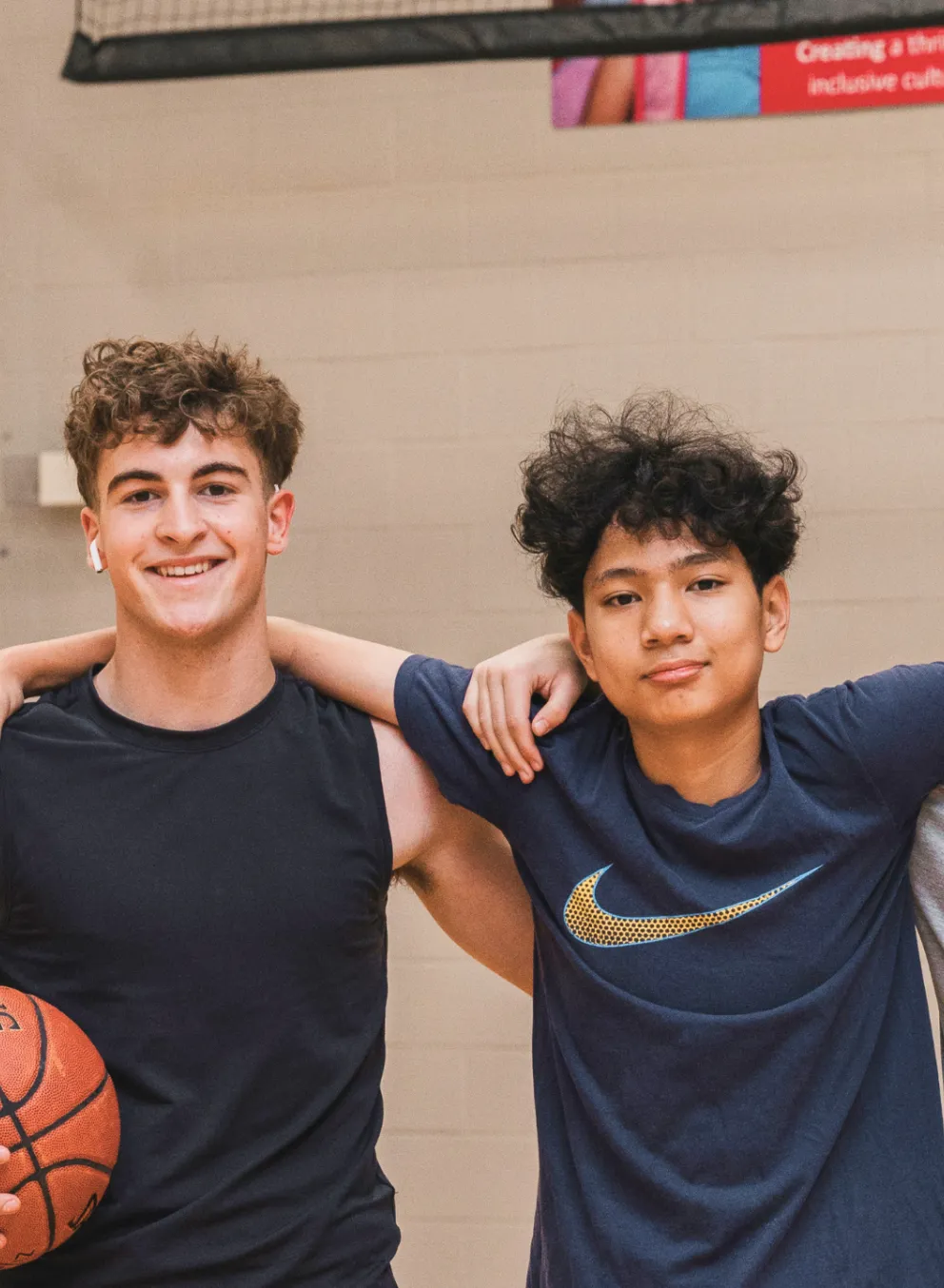 Three boys on basketball court