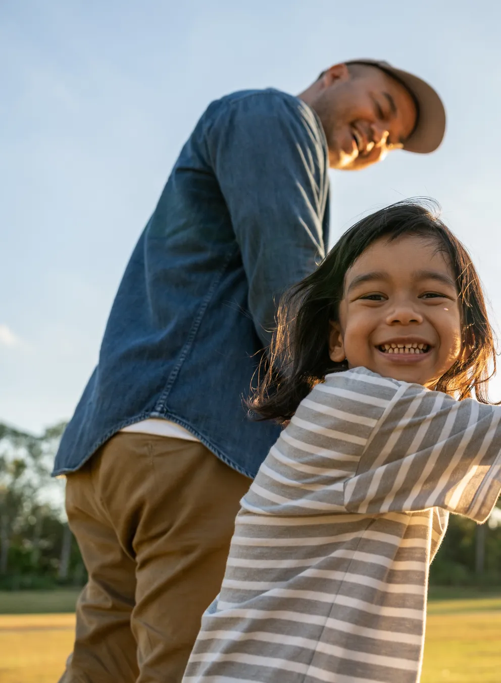 child holding parents hands