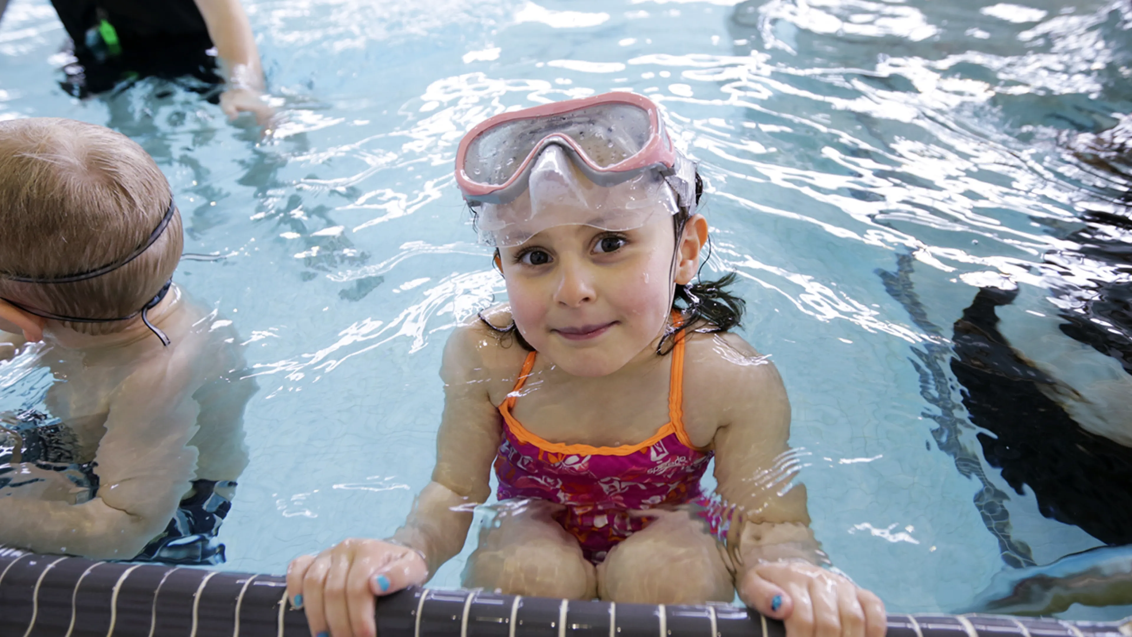 Female child participating in swim lessons