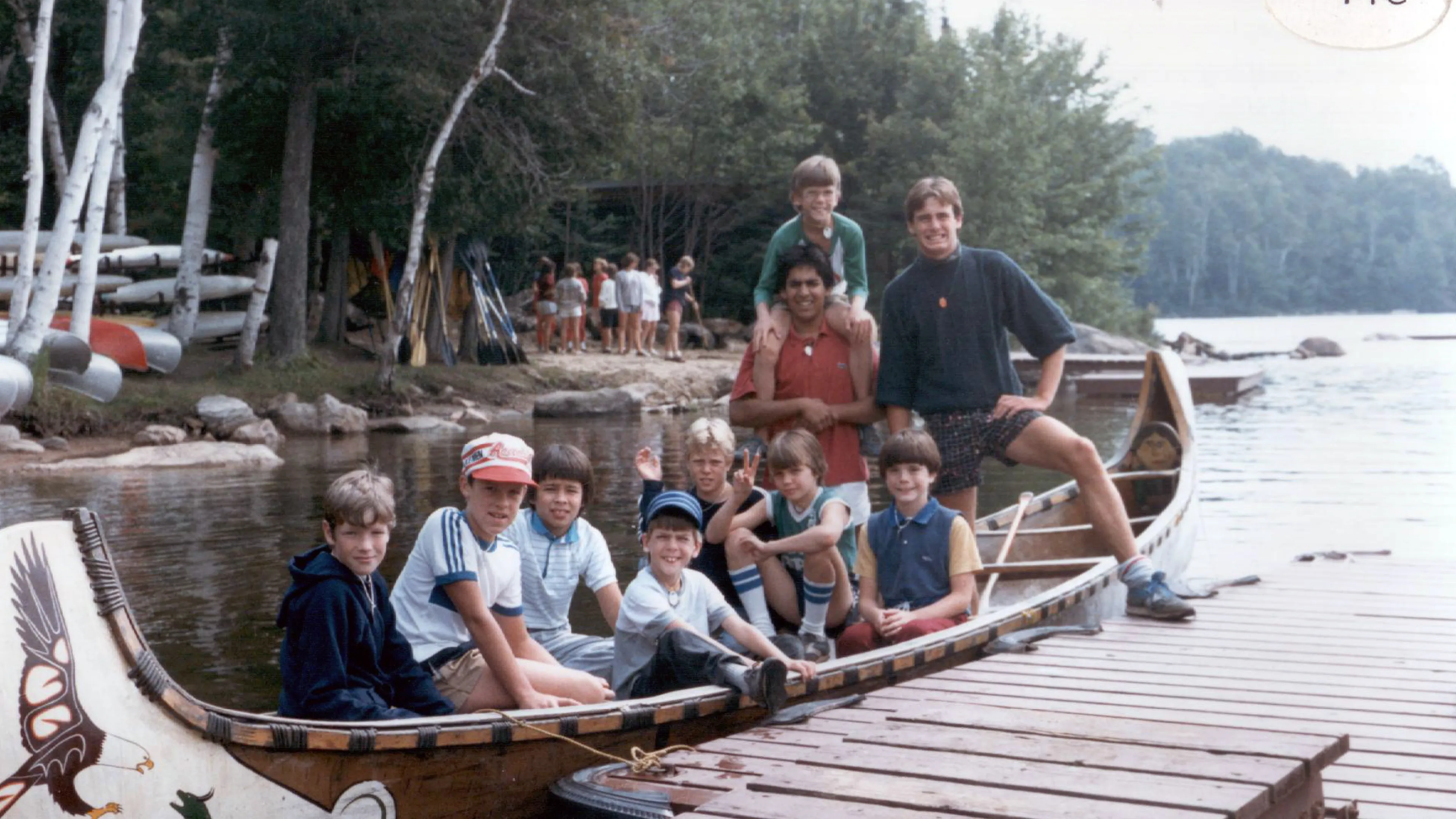 Campers sitting in voyageur canoe
