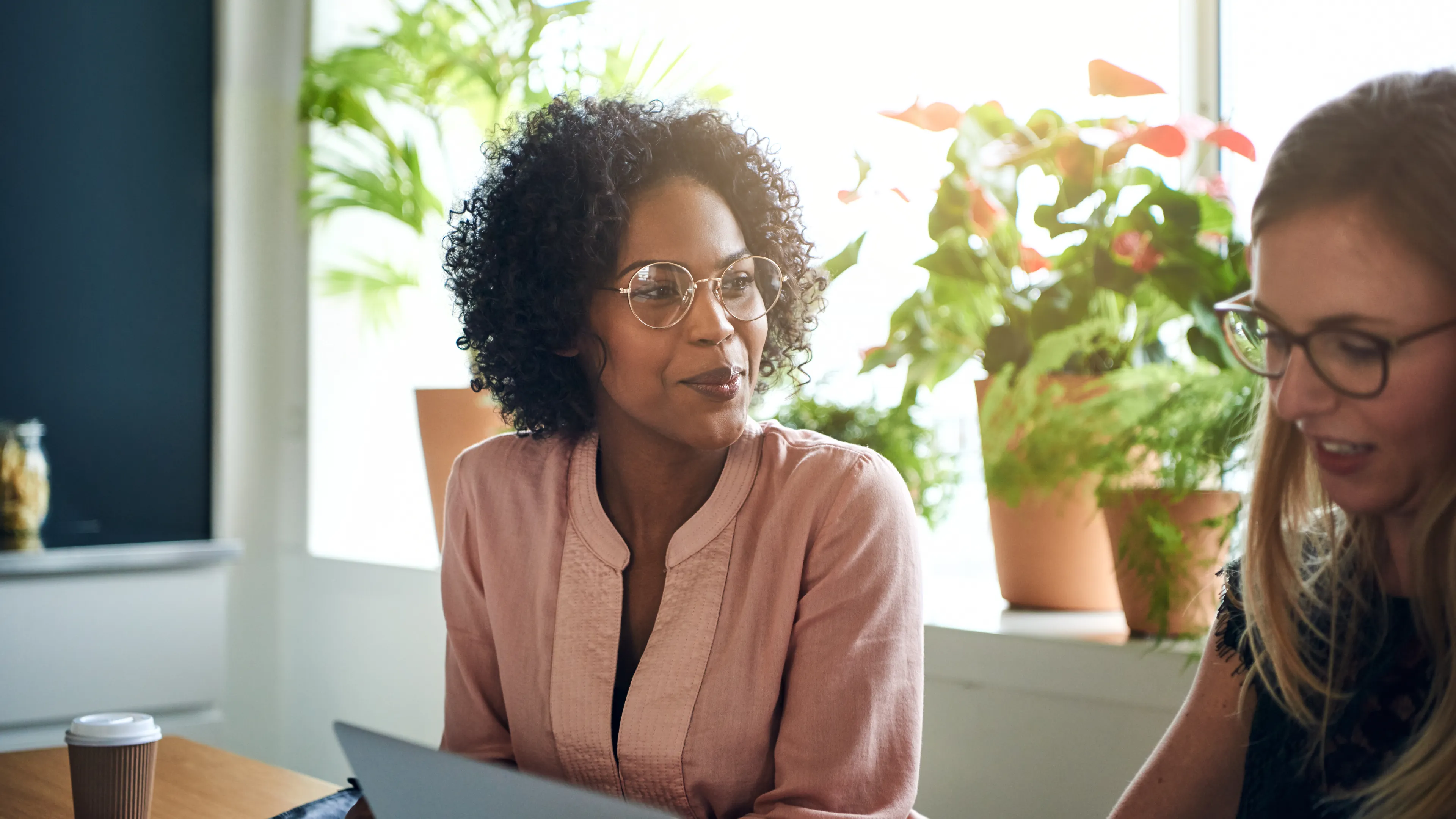 Two women looking at laptop