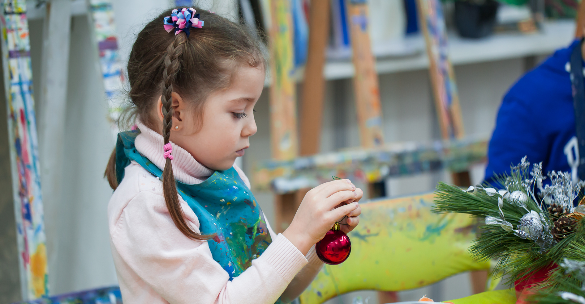 Female child participating in winter holiday crafts
