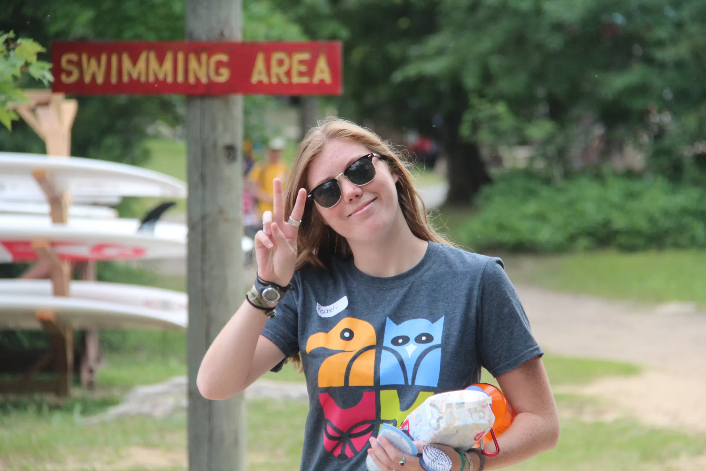 A Wanakita camp counsellor gives the peace sign