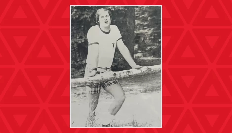 black and white photo of a young Wayne Perkins at camp