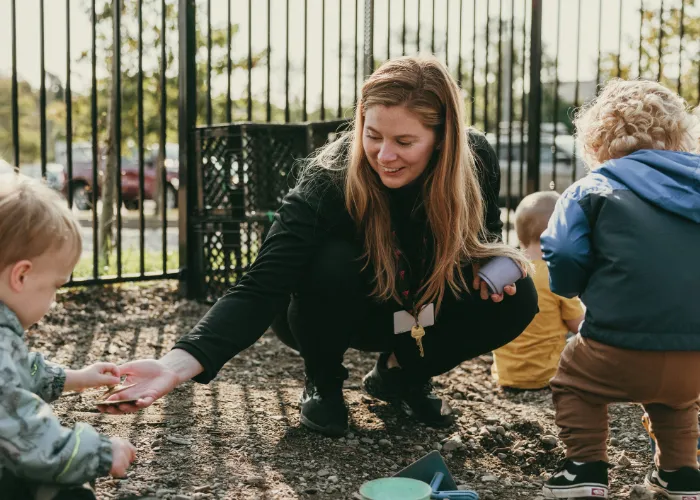 Female playing with kids in a park