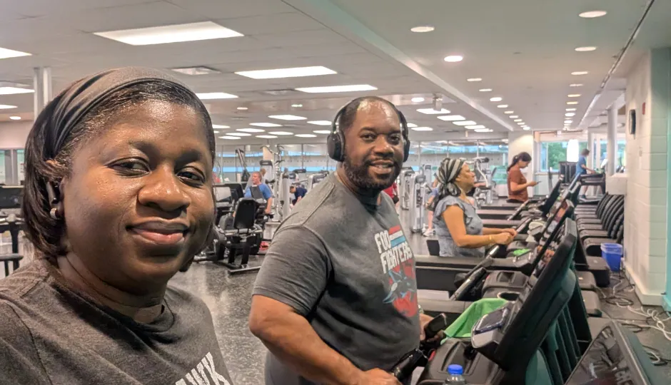 man and woman on treadmills