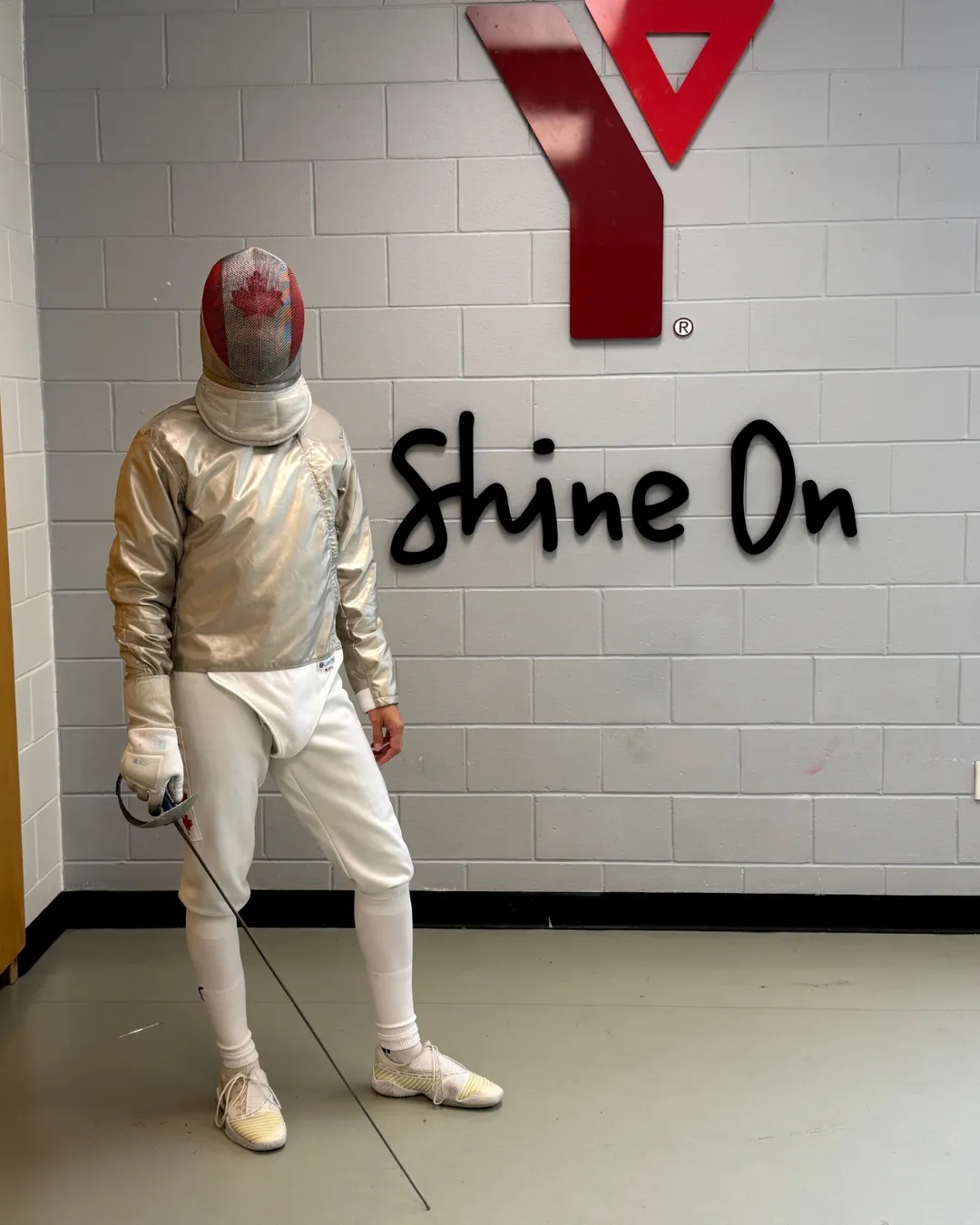 man in full fencing uniform