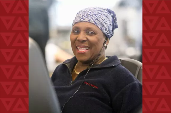Woman in black sweater and bandana with headphones in