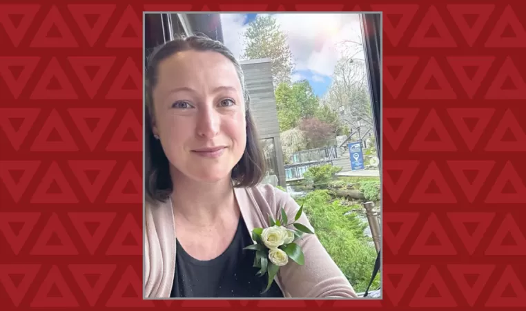 women takes selfie with a flower in her shirt pocket