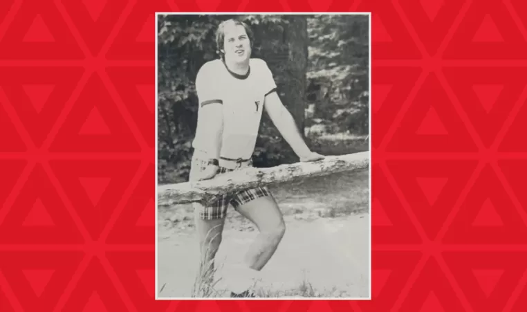 black and white photo of a young Wayne Perkins at camp