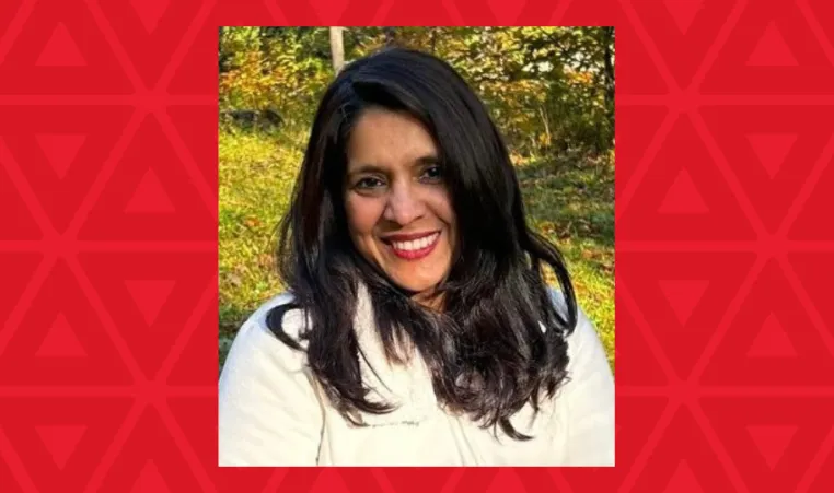 woman in white sweater smiling