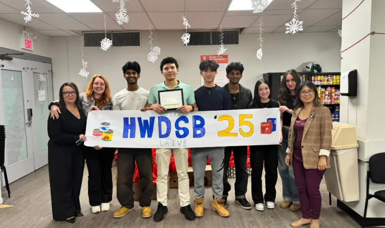tudents tustees at HWDSB holding banner following foo drive.png